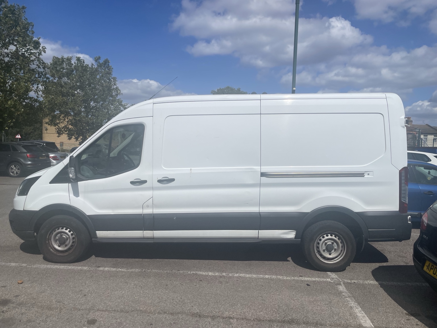 Side view of Van Crew Moves Transit